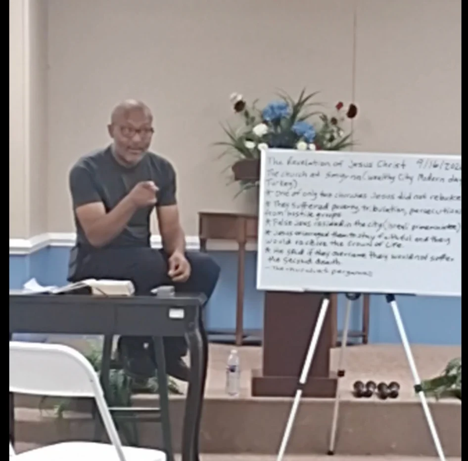 Apostle Tillman leading a Bible study at the Center